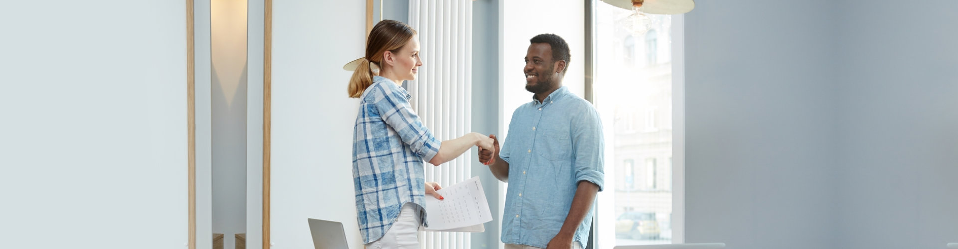 man and woman shaking hands